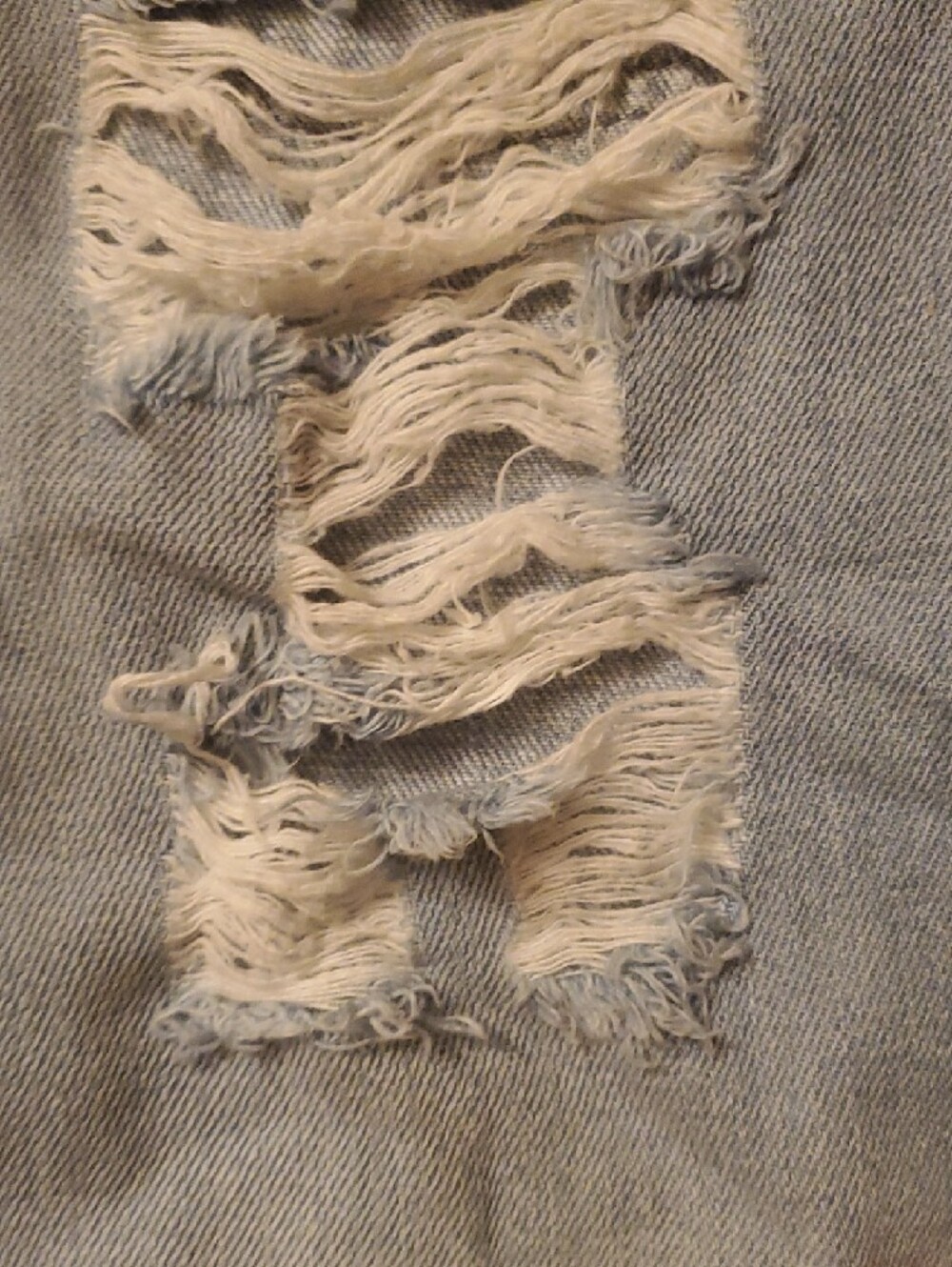 Light Wash Distressed Ripped Jeans - Picture 3 of 9